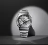 A silver G-Shock watch is displayed against a dark background with a spotlight. Voir les images du produit