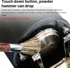 Close-up of a coffee tamper with a brush cleaning it. Produktbild-Vorschau