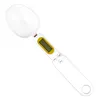 A digital spoon scale is shown against a white background. Náhled obrázku produktu