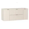 A product shot of a cream-colored vanity with fluted fronts and gold handles against a white background. Podgląd zdjęcia produktu