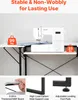 A sewing machine is placed on a white table with black legs, demonstrating its stability and load-bearing capacity. Produktbild-Vorschau