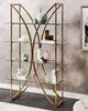 A gold and glass bookshelf filled with decorative items. Náhľad obrázku produktu