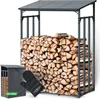 A metal firewood rack filled with logs, with a cover and oven mitt in the foreground. Produktbild-Vorschau