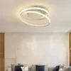 A modern living room with a stylish ceiling light fixture above a sofa. Produktbild-Vorschau