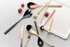 A collection of cutlery and radishes arranged on a light gray surface with a white tray. Produktbild-Vorschau