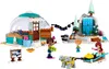 A LEGO set depicting a winter scene with an igloo, a waterfall, sled dogs, and mini-doll figures. Produktbild-Vorschau