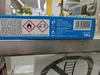 The image shows the side panel of a product box, likely for car care products, with various warning symbols and text. Podgląd zdjęcia produktu