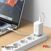 A white USB-C charger and cable are plugged into a white power strip, charging a smartphone connected to a laptop. Produktbild-Vorschau