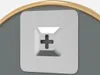 A close-up view of a screw head with a cross-shaped slot, set against a gray background and a golden curved element. Náhľad obrázku produktu