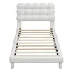 A white upholstered bed frame with a tufted headboard and wooden slats, shown from the front. Produktbild-Vorschau