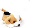 A plush toy dog lying down on a white background. Anteprima dell’immagine prodotto