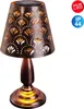 A solar-powered table lamp with a decorative, perforated metal shade. Anteprima dell’immagine prodotto