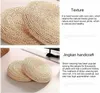 Two images showing round woven cushions, with accompanying text describing their texture and craftsmanship. Produktbild-Vorschau