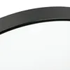 A close-up view of the edge of a black ceiling lamp. Produktbild-Vorschau
