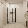 A modern bathroom with a corner shower enclosure, terrazzo flooring, and tiled walls. Produktbild-Vorschau
