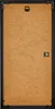 The back of a black picture frame with a brown backing board. Produktbild-Vorschau