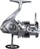 A studio shot of a fishing reel against a white background. Produktbild-Vorschau