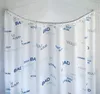 A white shower curtain with blue and light blue text patterns, hanging from a curved shower rod in a corner shower. Podgląd zdjęcia produktu