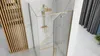 A modern bathroom with a gold-framed glass shower enclosure. Produktbild-Vorschau