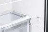 A close-up view of the interior of a refrigerator, showing a clear drawer and a control panel. Produktbild-Vorschau