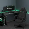 A gaming setup with a desk, chair, computer, and monitor, illuminated by green LED lights. Produktbild-Vorschau