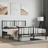 A black metal bed frame with a mattress and bedding is shown in a bedroom setting. Náhled obrázku produktu