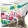 A British Shorthair cat is lying in front of a display of cat food pouches. Produktbild-Vorschau