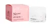 A pink box and a white jar of sunscreen are shown against a white background. Náhled obrázku produktu