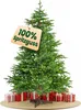 A green artificial Christmas tree with presents underneath and a tag indicating "100% Spritzguss". Produktbild-Vorschau