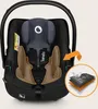 A close-up view of a baby car seat with an inset showing a layered material. Anteprima dell’immagine prodotto