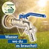 A garden faucet with a blue handle is shown in focus, with a blurred background of a sprinkler system watering grass. Produktbild-Vorschau