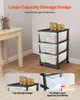A storage cart with three drawers is shown next to a wooden table, with some items on top of the cart and in the drawers. Produktbild-Vorschau