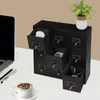A black wooden drawer organizer with multiple drawers, some open, sits on a white desk next to a laptop, a cup of coffee, and a small potted plant. Podgląd zdjęcia produktu
