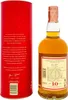A bottle of Glenfarclas Highland Single Malt Scotch Whisky and its red cylindrical packaging. Produktbild-Vorschau