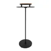A black floor stand with a round base and two circular shelves, one made of wood. Podgląd zdjęcia produktu