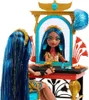 A doll is sitting at a vanity, looking in the mirror and applying makeup. Podgląd zdjęcia produktu