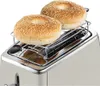 A close-up view of a toaster with two sesame seed bagels on a warming rack. Anteprima dell’immagine prodotto