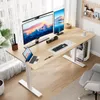 A modern home office setup with a standing desk, multiple monitors, and a computer. Anteprima dell’immagine prodotto