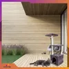 A cat is lying on a wooden deck next to a cat tree, with a modern wooden house in the background. Náhľad obrázku produktu