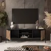 A modern living room with a TV stand, TV, and decorative items. Produktbild-Vorschau