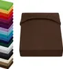 A stack of colorful fitted sheets is shown on the left, and a single brown fitted sheet is displayed on the right. Produktbild-Vorschau