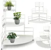Collage of white metal corner plant stands with plants on them, shown from different angles and perspectives. Voir les images du produit