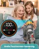 An older woman and a young girl are sitting on a couch, looking at a vacuum cleaner and its digital display. Produktbild-Vorschau