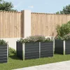 A garden scene with raised garden beds in front of a wooden fence. Voir les images du produit