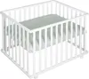 A white playpen with a green mattress inside, shown from a slightly elevated angle. Náhled obrázku produktu