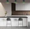 A modern kitchen with pendant lights, a counter, and bar stools. Produktbild-Vorschau