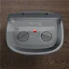 Overhead view of a gray fan heater placed on a wooden floor. Anteprima dell’immagine prodotto