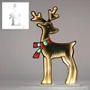 A lit-up reindeer decoration with a scarf, displayed against a plain background. Anteprima dell’immagine prodotto