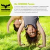 Two children doing handstands on a grassy lawn. Podgląd zdjęcia produktu