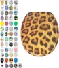 A toilet seat with a leopard print pattern is shown on a white background, next to a grid of other toilet seat designs. Produktbild-Vorschau